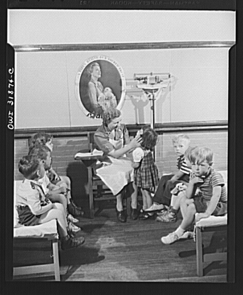 Children and a nurse at a child care center in New Britain, Connecticut. The center opened in 1942 and provided care for mothers engaged in work in the war industry. (Source: Library of Congress)