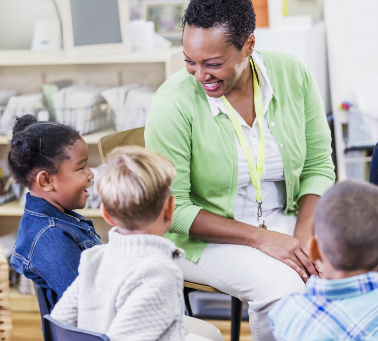 Teacher and young children in class