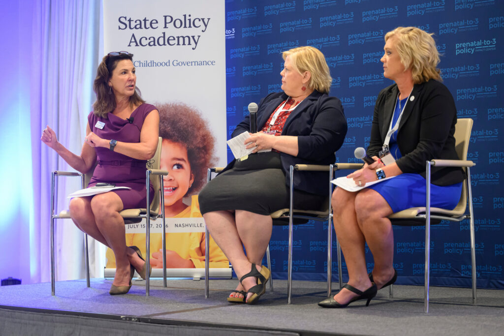 Three individuals participate in a panel discussion at the State Policy Academy, with a backdrop featuring "prenatal-to-3 policy" and a child's image.