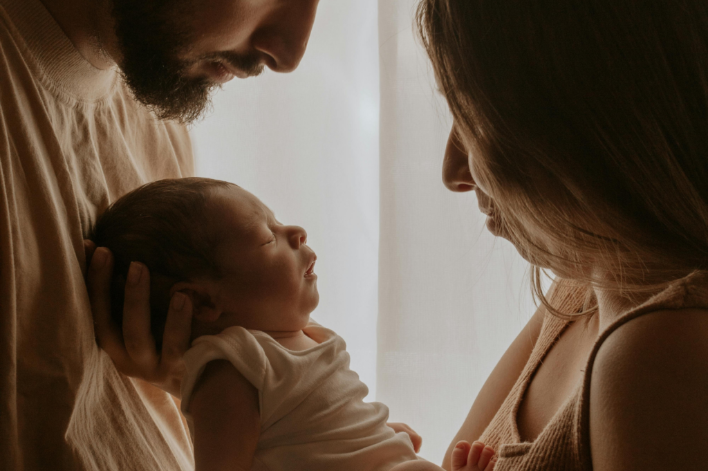 Family holding a baby