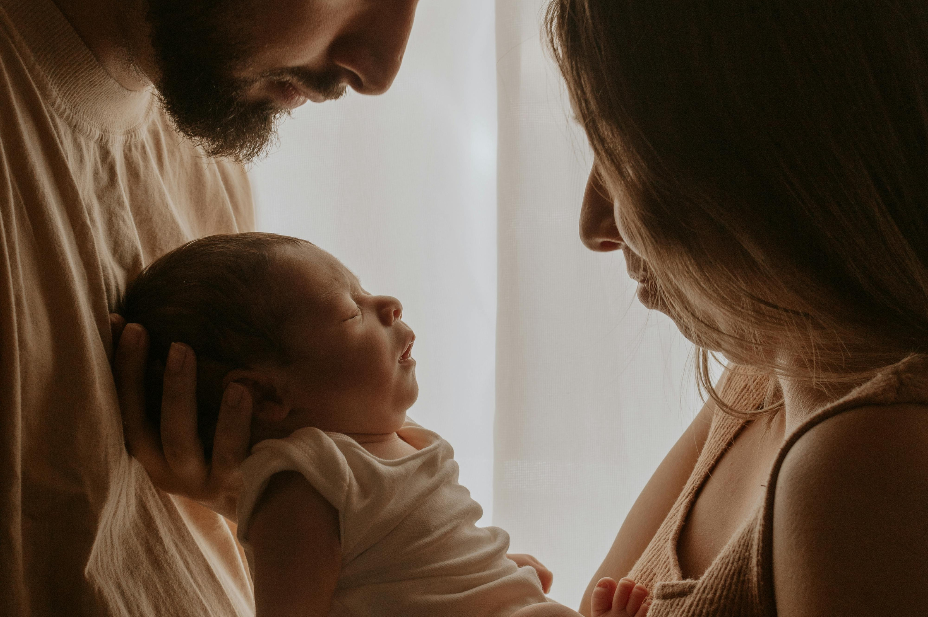 Family holding a baby
